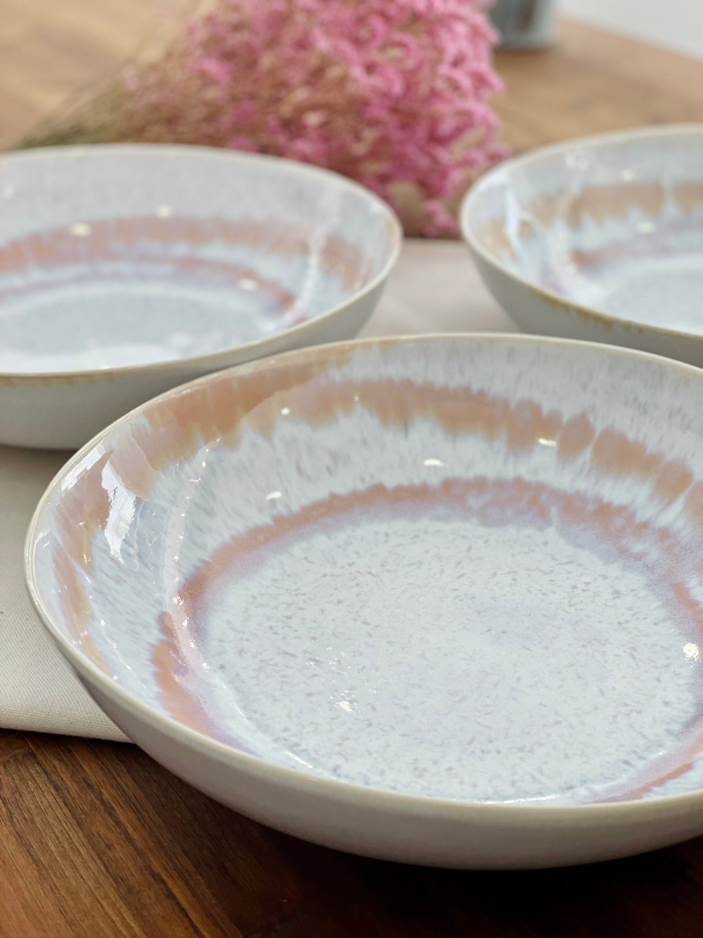 Large salad bowl with reactive glaze in shades of pink